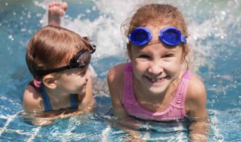Chlorine might not be your teeth’s best friend, but don’t let pool chemicals prevent you from diving in!