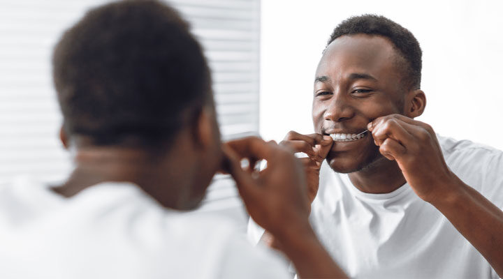 Lower Risk of Oral Cancer Linked to Flossing, Dentist Visits